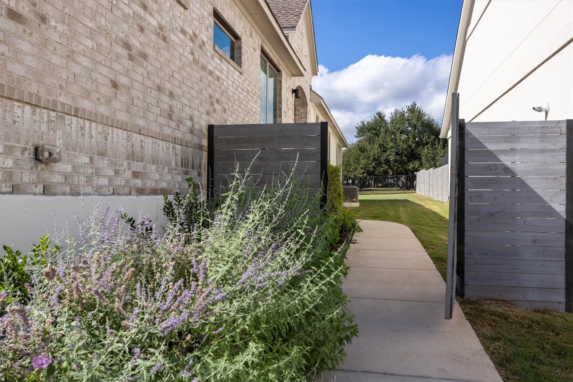 1122 Silver Dollar Trail Georgetown, TX 78628 - Photo 4 of 35 a pathway of a house with a yard