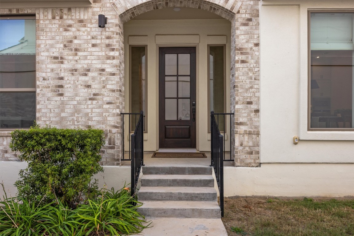 1122 Silver Dollar Trail Georgetown, TX 78628 - Photo 5 of 35 a front view of a house with a garden