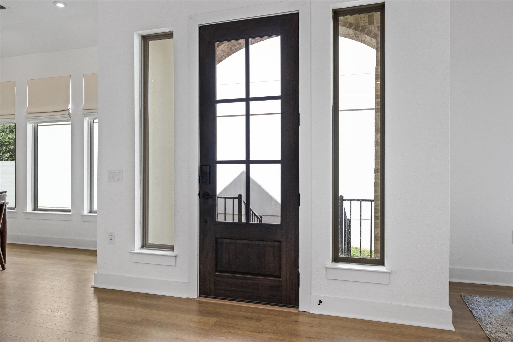 1122 Silver Dollar Trail Georgetown, TX 78628 - Photo 6 of 35 an empty room with wooden floor and windows
