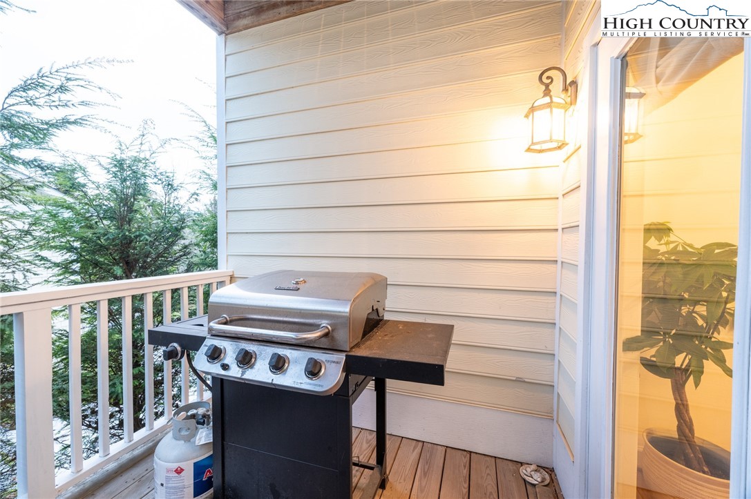 114 Charles Lowe Lane, Unit 19 Banner Elk, NC 28604 - Photo 32 of 38 a view of a balcony with chairs