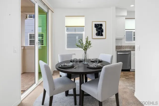 a view of a dining room with furniture and window
