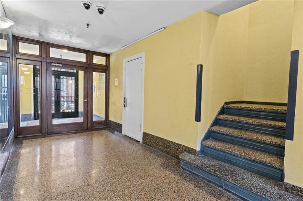 191 Clinton Street, Unit 2B Brooklyn, NY 11201 - Photo 9 of 10 a view of a room with wooden floor and stairs