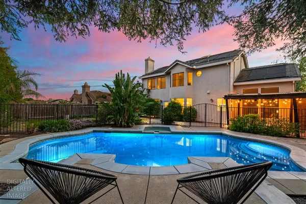a view of a swimming pool with a patio