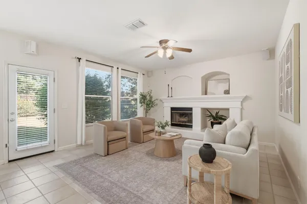 a living room with furniture and a large window