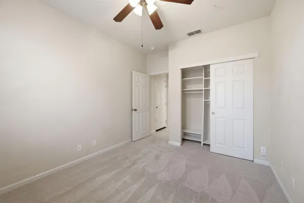 a view of a hallway with closet area