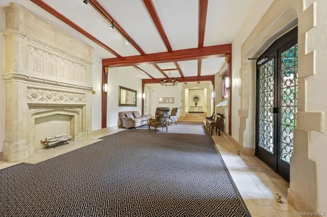 a view of a livingroom with furniture a fireplace