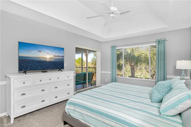 a bedroom with a flat screen television and a bed