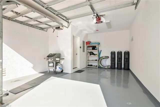 a view of a livingroom with a chair and the entryway