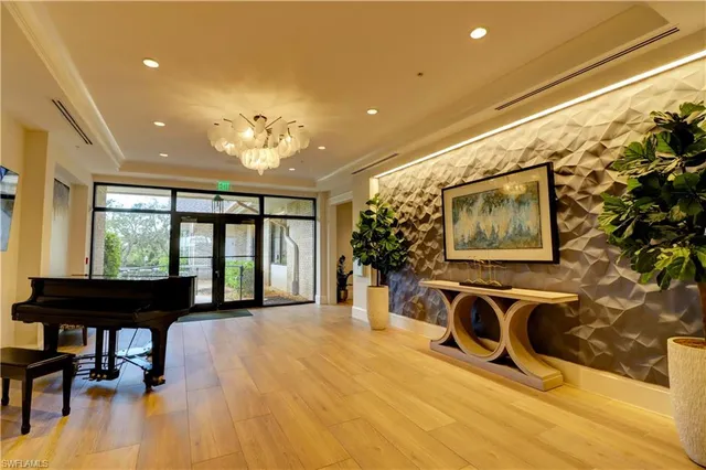 a view of a livingroom with furniture and a flat screen tv