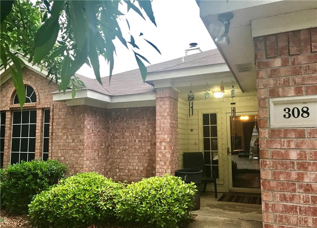308 Palm Street Crowley, TX 76036 - Photo 1 of 1 a front view of a house with a yard