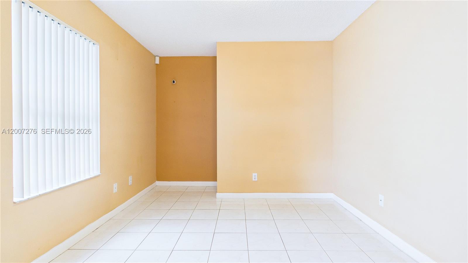 17626 Southwest 20th Street Miramar, FL 33029 - Photo 11 of 27 a view of an empty room with a window