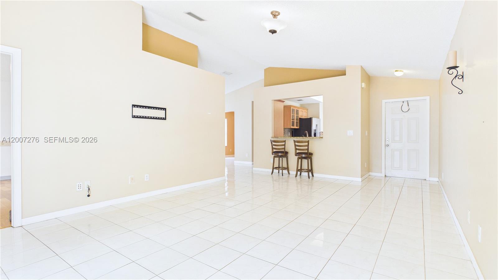 17626 Southwest 20th Street Miramar, FL 33029 - Photo 15 of 27 a view of empty room with wooden floor