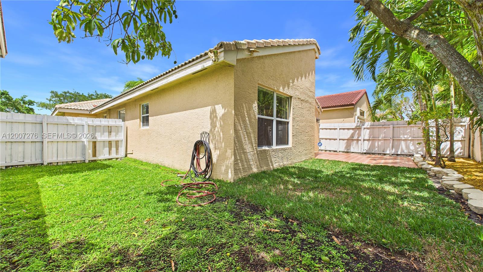 17626 Southwest 20th Street Miramar, FL 33029 - Photo 18 of 27 a front view of a house with a yard