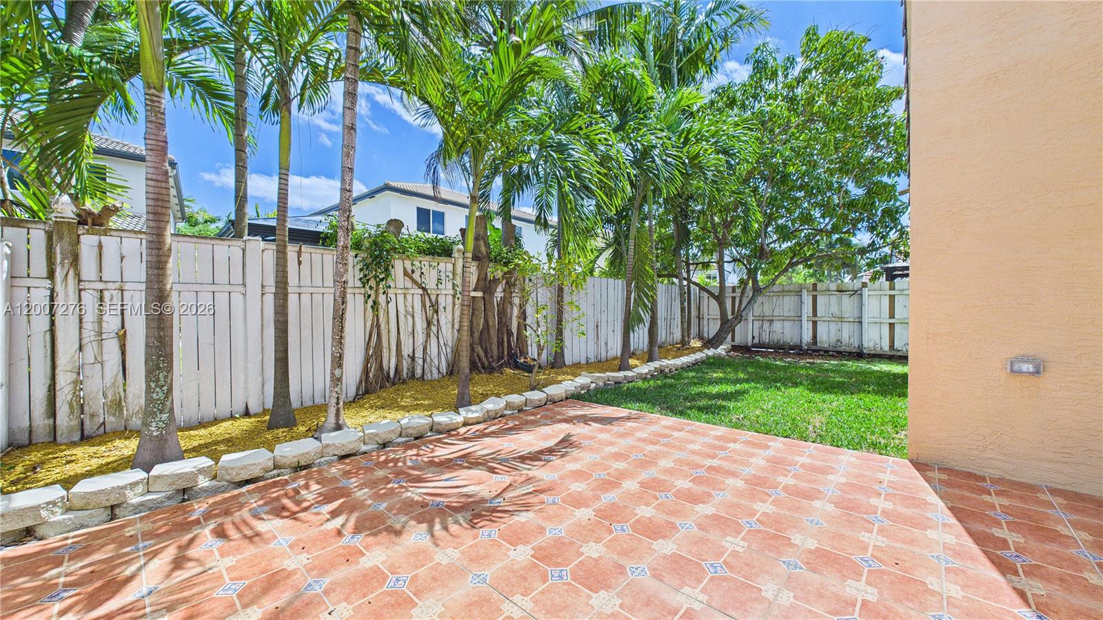 17626 Southwest 20th Street Miramar, FL 33029 - Photo 20 of 27 a backyard of a house with lots of green space
