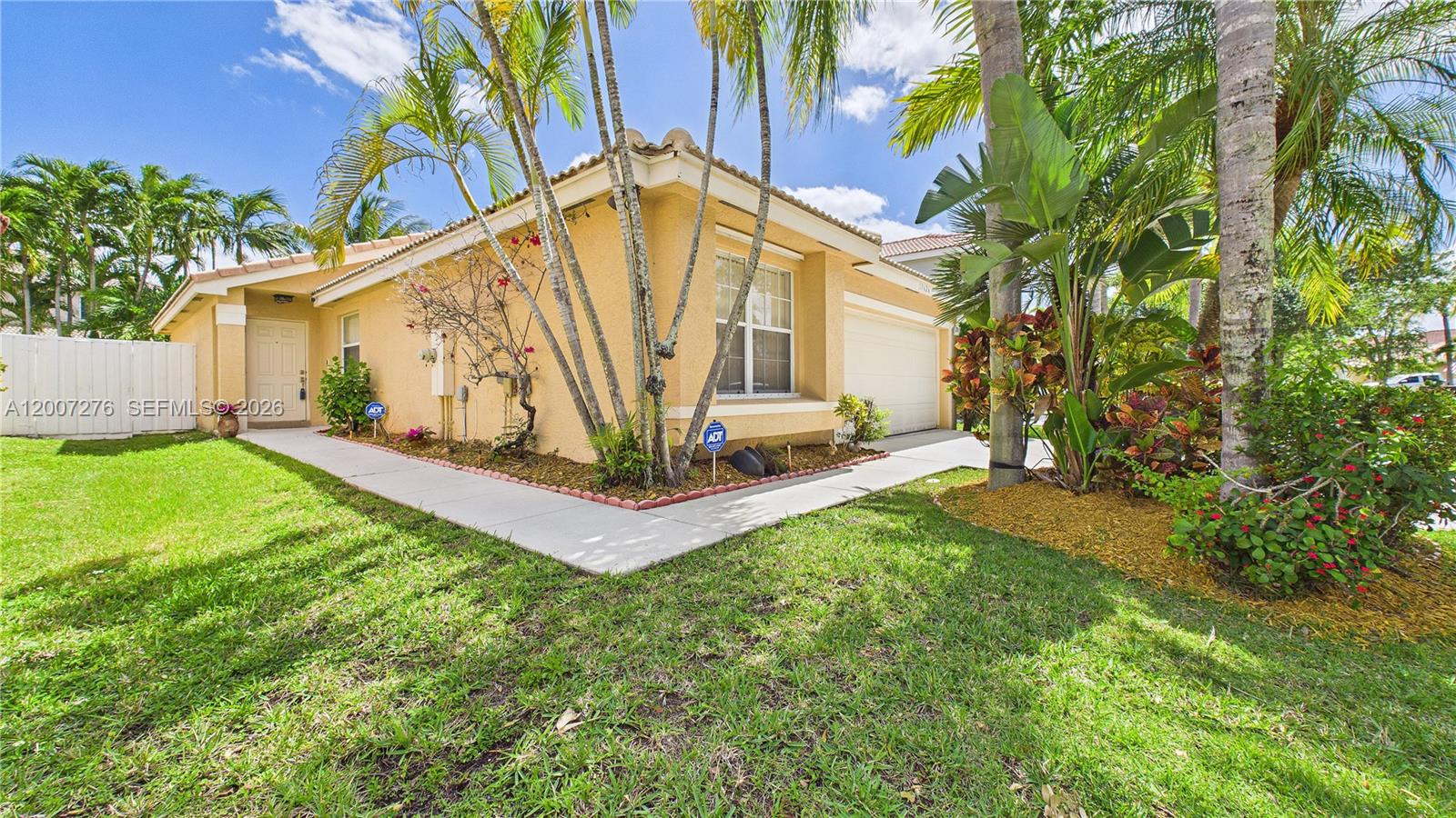 17626 Southwest 20th Street Miramar, FL 33029 - Photo 2 of 27 a view of an house with backyard and garden
