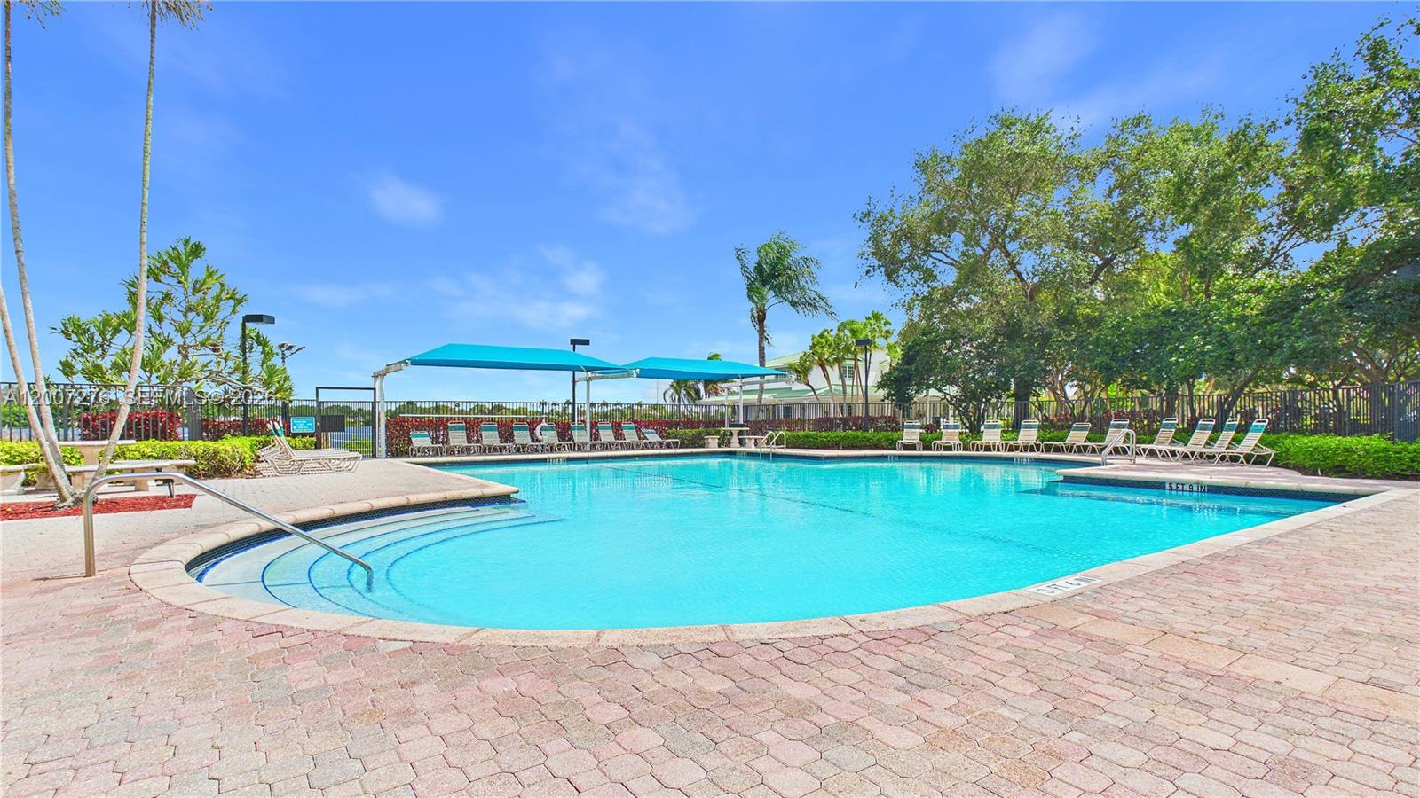 17626 Southwest 20th Street Miramar, FL 33029 - Photo 22 of 27 a view of a swimming pool with an outdoor seating