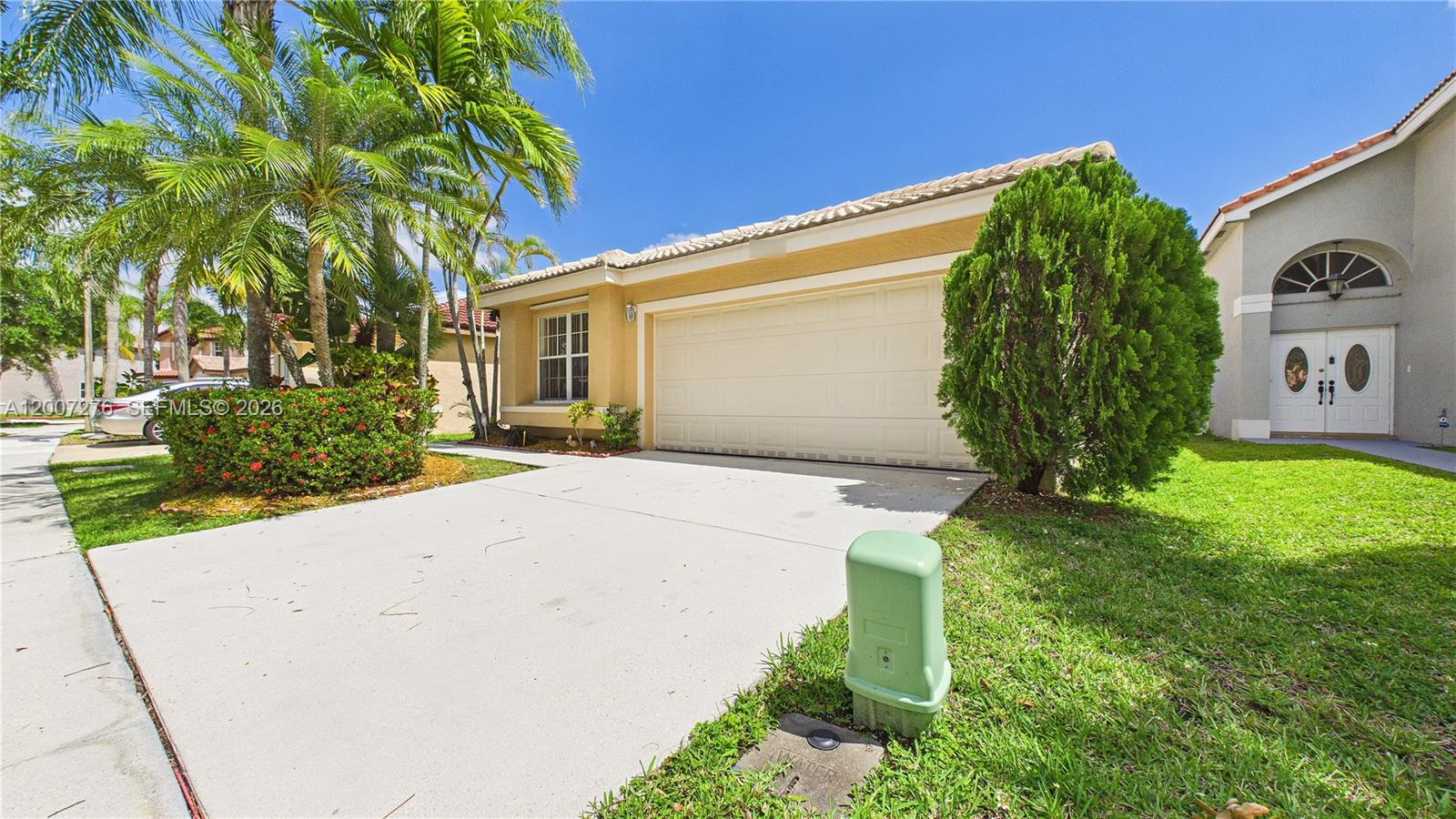 17626 Southwest 20th Street Miramar, FL 33029 - Photo 3 of 27 a front view of a house with garden