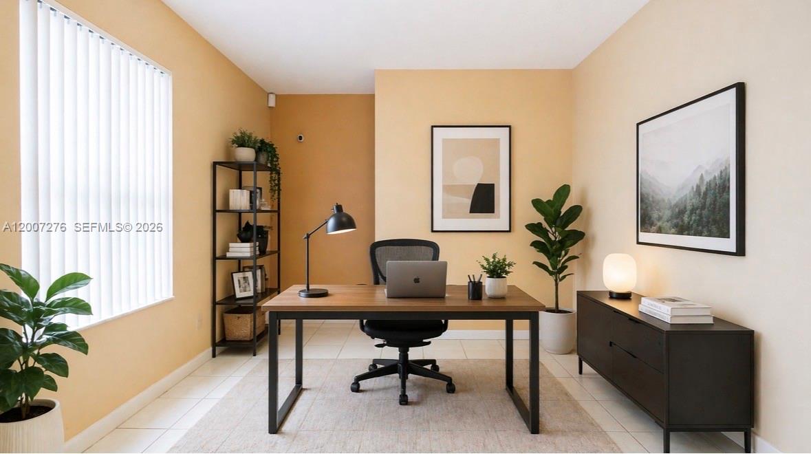 17626 Southwest 20th Street Miramar, FL 33029 - Photo 5 of 27 a workspace with furniture and a potted plant