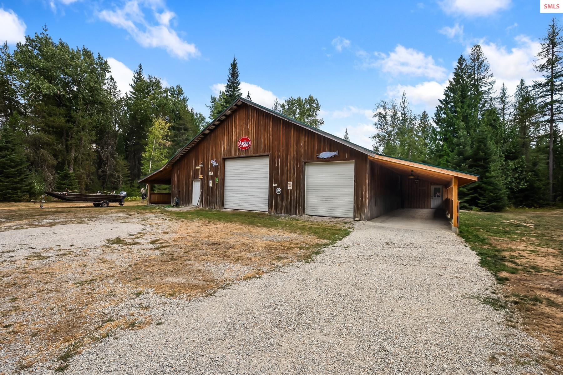 7017-7019 Colburn Culver Road Sandpoint, ID 83864 - Photo 42 of 75 Newly added Carport allows for two car covered parking and direct access to the living quarters