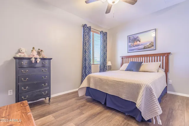 a bedroom with a bed and a dresser