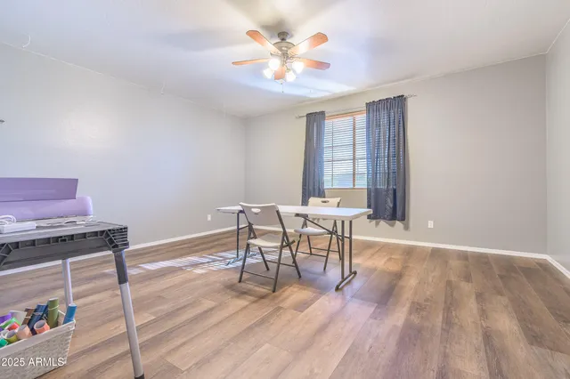 a workspace with furniture window and wooden floor