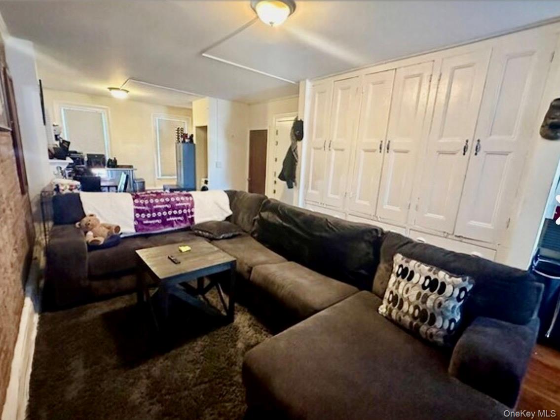 118 Main Street, Unit 3 Nyack, NY 10960 - Photo 17 of 20 a living room with furniture or couch and a chandelier