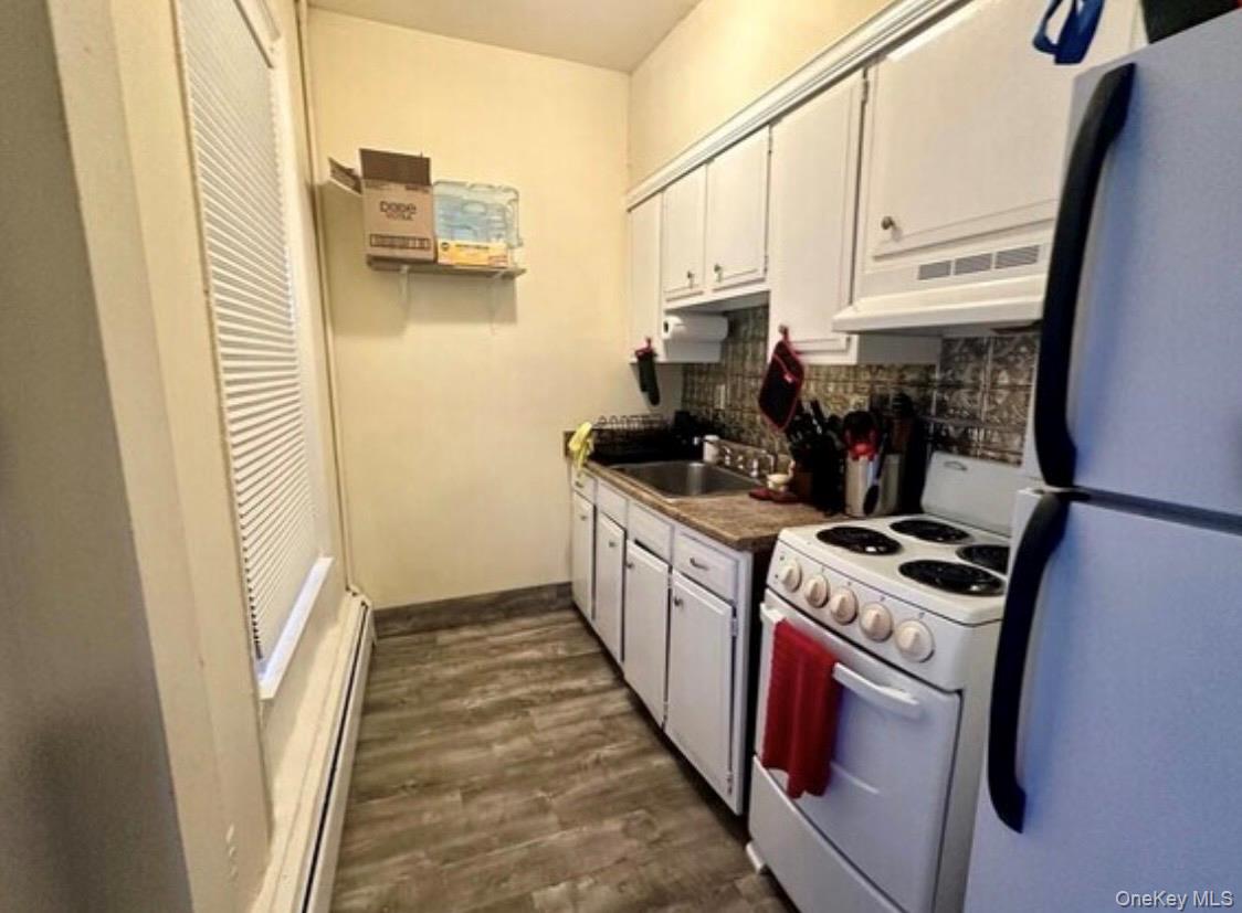 118 Main Street, Unit 3 Nyack, NY 10960 - Photo 19 of 20 a kitchen with a sink a stove and a refrigerator