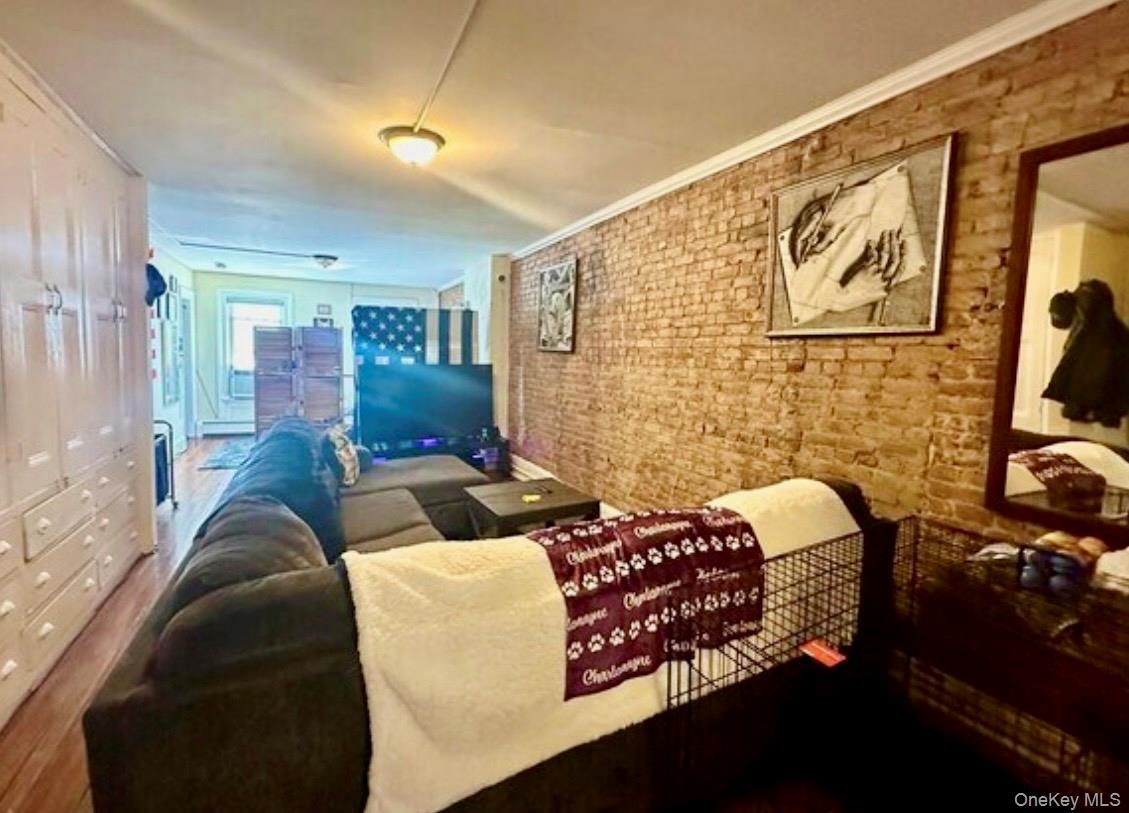 118 Main Street, Unit 3 Nyack, NY 10960 - Photo 20 of 20 a bedroom with a bed next to a window