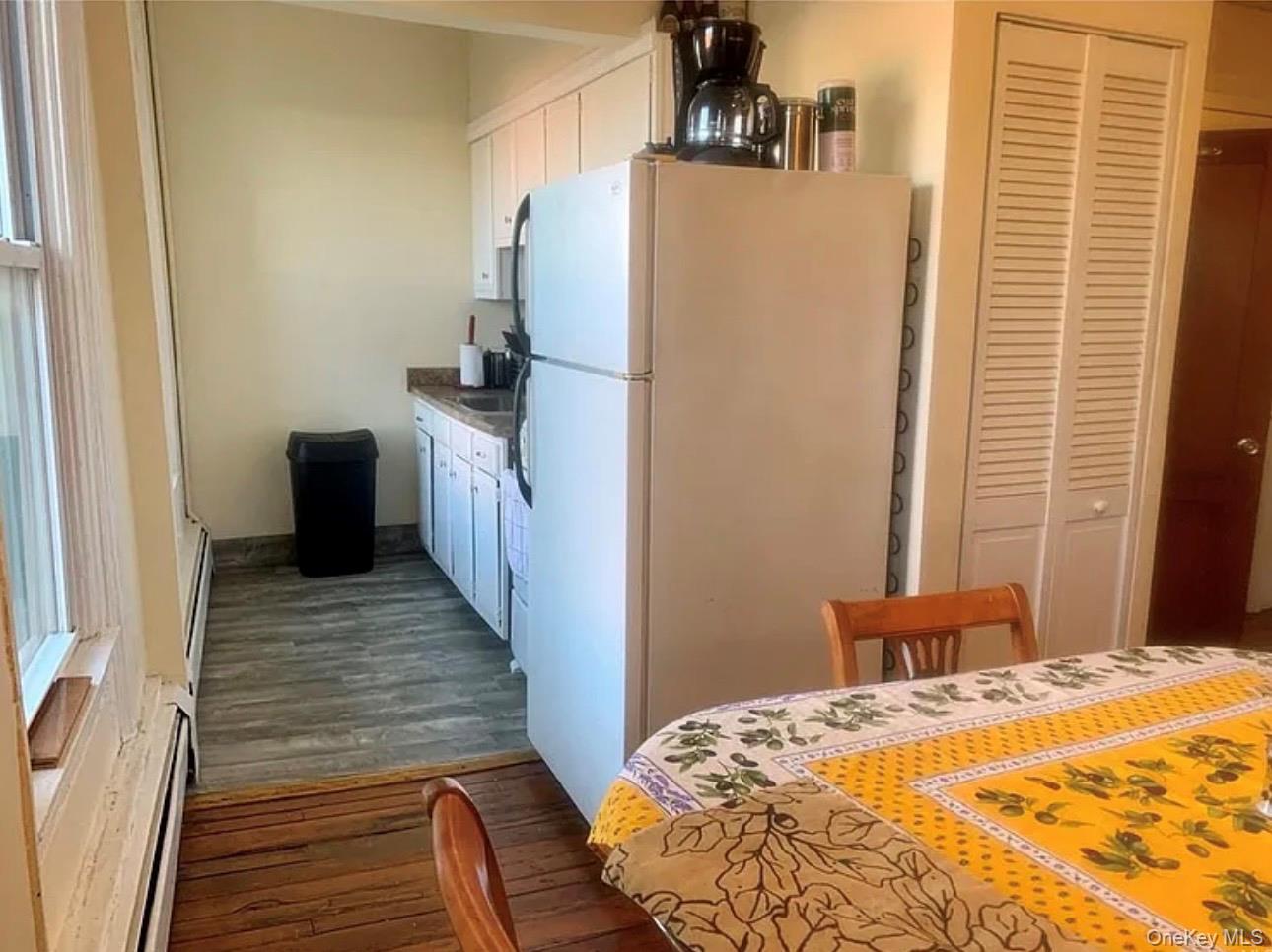 118 Main Street, Unit 3 Nyack, NY 10960 - Photo 6 of 20 a bedroom with a bed and wooden floor