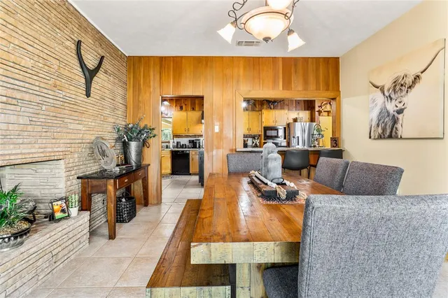 a living room with furniture a couch and a window