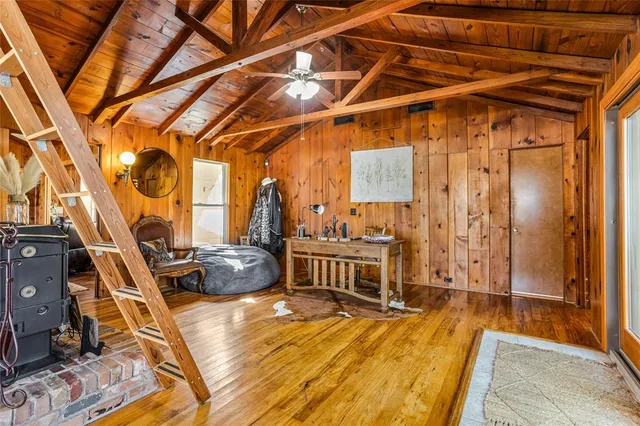 a living room with furniture a large window