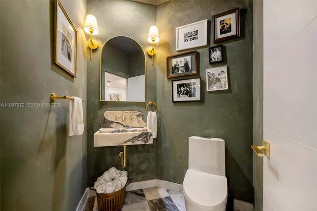 a room with furniture a bookshelf and a window