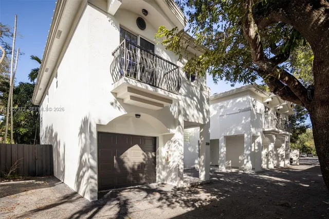 a kitchen with a table and chairs in it