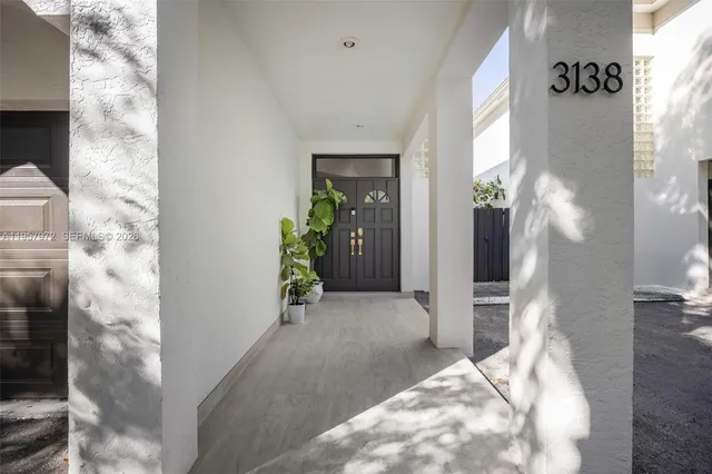 a kitchen with a table and chairs in it