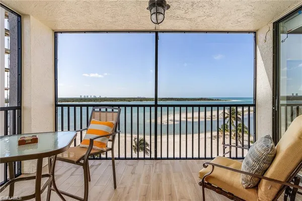 a view of a balcony with furniture