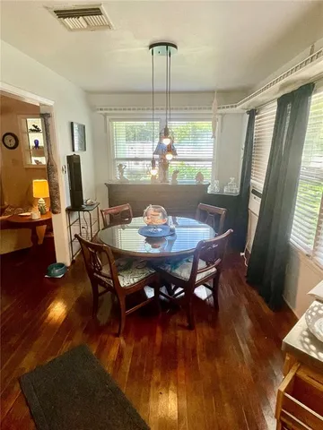 a bedroom with a bed a mirror and a desk