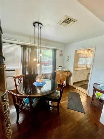 a bedroom with a bed and a lamp on table