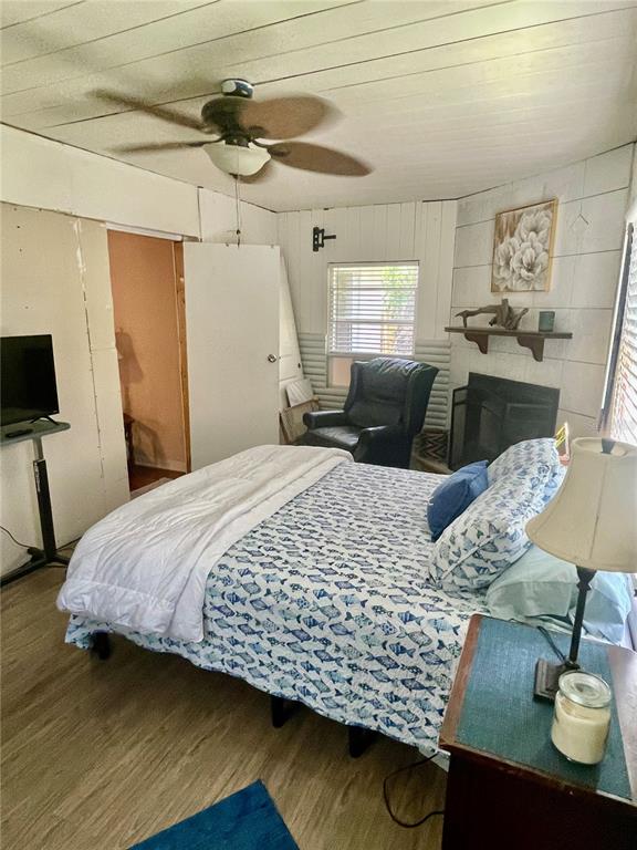 578 3rd Street Daytona Beach, FL 32117 - Photo 33 of 88 a bedroom with a bed and dresser with the potted plant