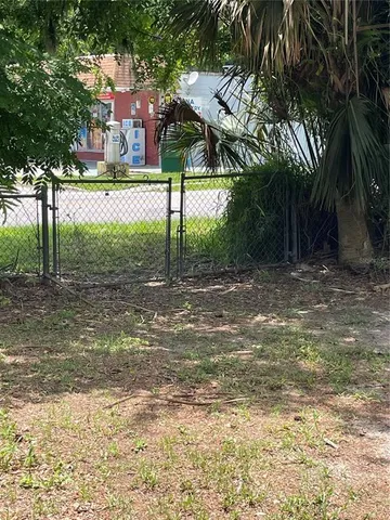a view of a yard and a house