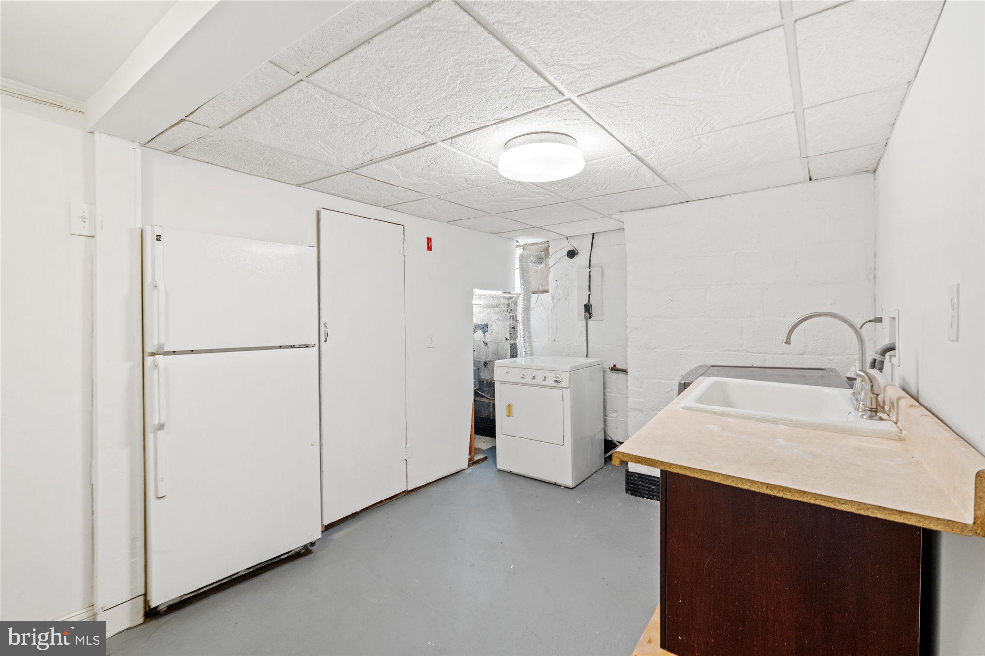 823 Bonifant Street Silver Spring, MD 20910 - Photo 33 of 42 Lower level laundry and second fridge