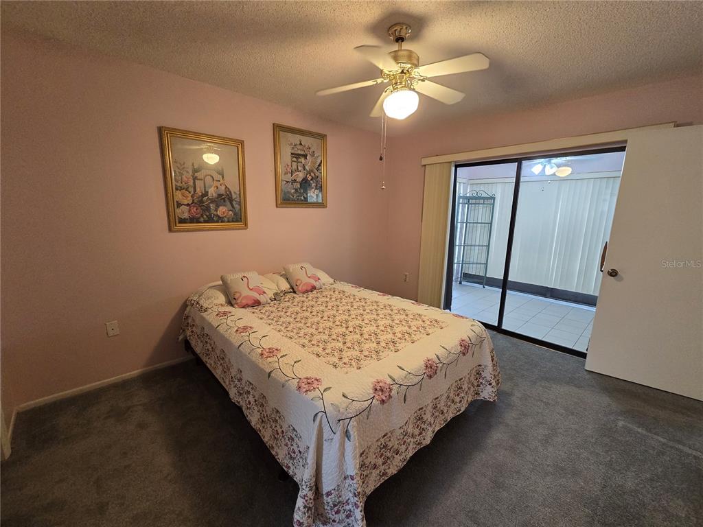 8055 Picketts Court, Unit 8055 Weeki Wachee, FL 34613 - Photo 12 of 22 a bedroom with a bed and a window