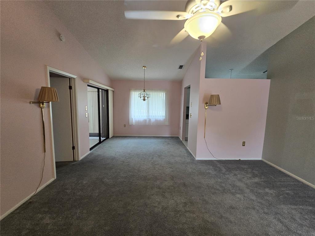 8055 Picketts Court, Unit 8055 Weeki Wachee, FL 34613 - Photo 3 of 22 a view of an empty room with a window