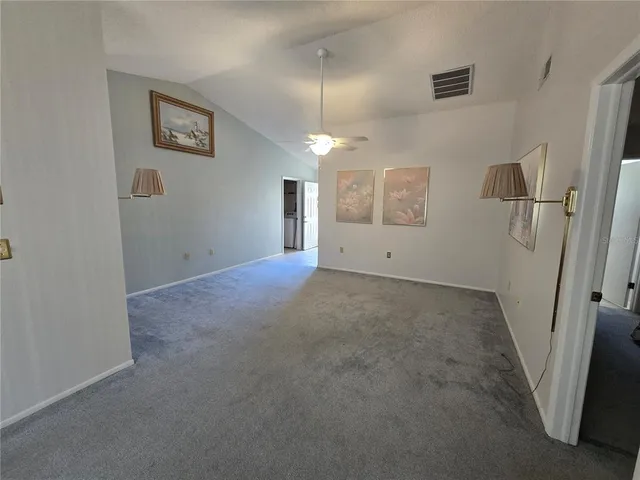 an empty room with windows and entrance