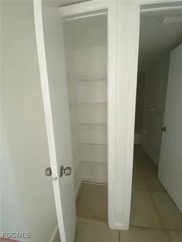 a bathroom with a glass door shower