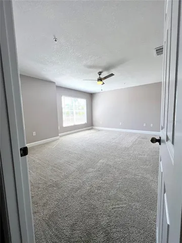 a view of a living room with a sink and wooden floor