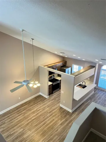 a kitchen with stainless steel appliances a sink and cabinets