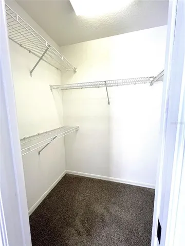 a utility room with wooden floor washer and dryer