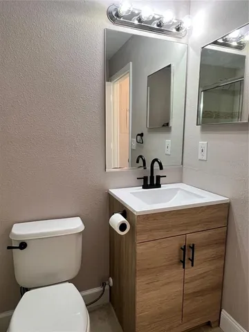 a front view of a house with a yard and outdoor seating