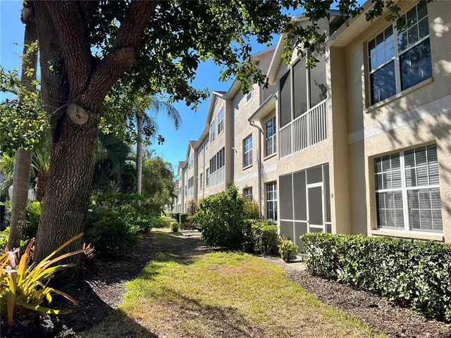a living room with fireplace furniture and a chandelier