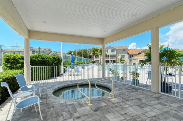 an aerial view of multiple houses with yard